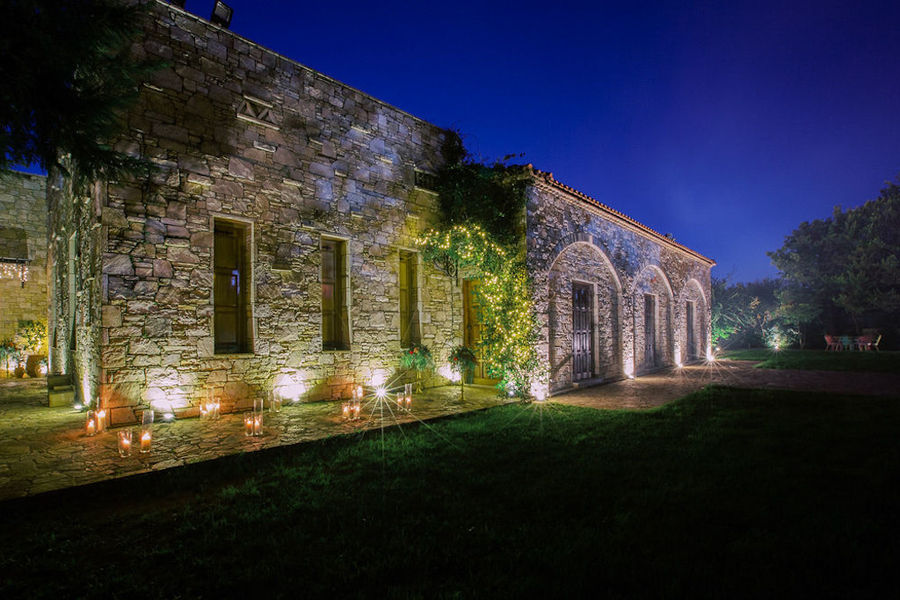 view by night of Kellari Papachristou winery stone building